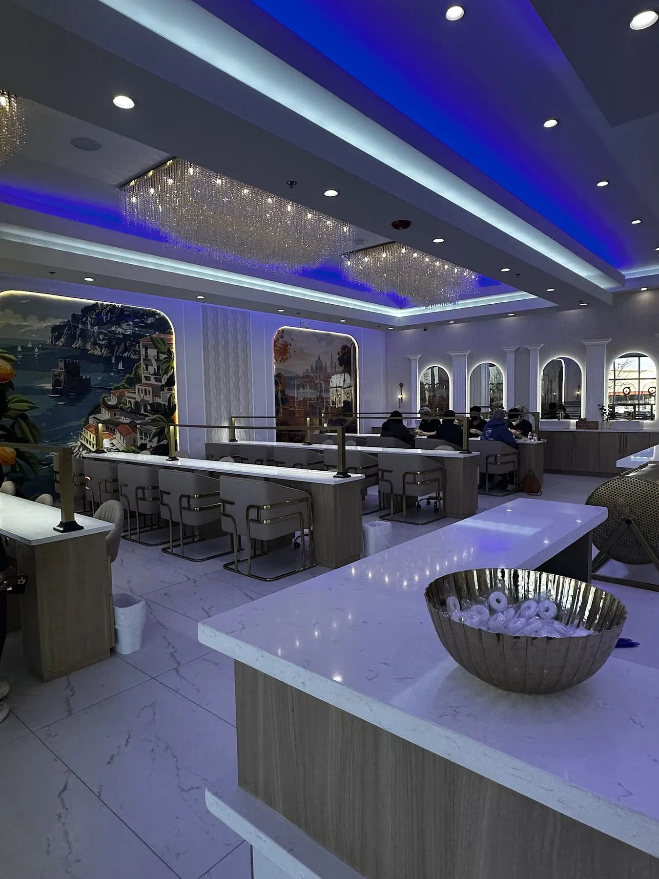 Welcome bar and hand-painted mural wall at Gloss Nail Bar Machesney Park