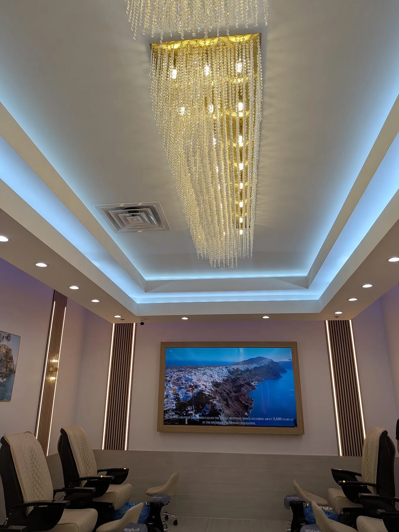 Cascading gold chandelier above the Geneva spa lounge