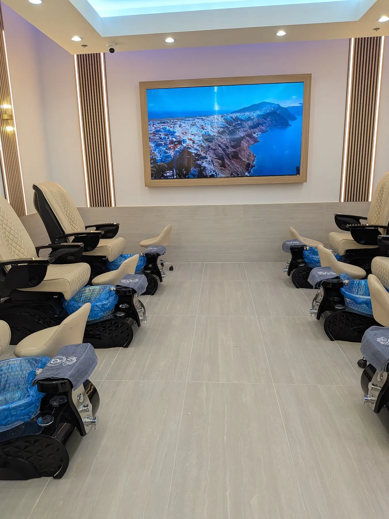 Pedicure thrones facing a Santorini vista display at Geneva Commons
