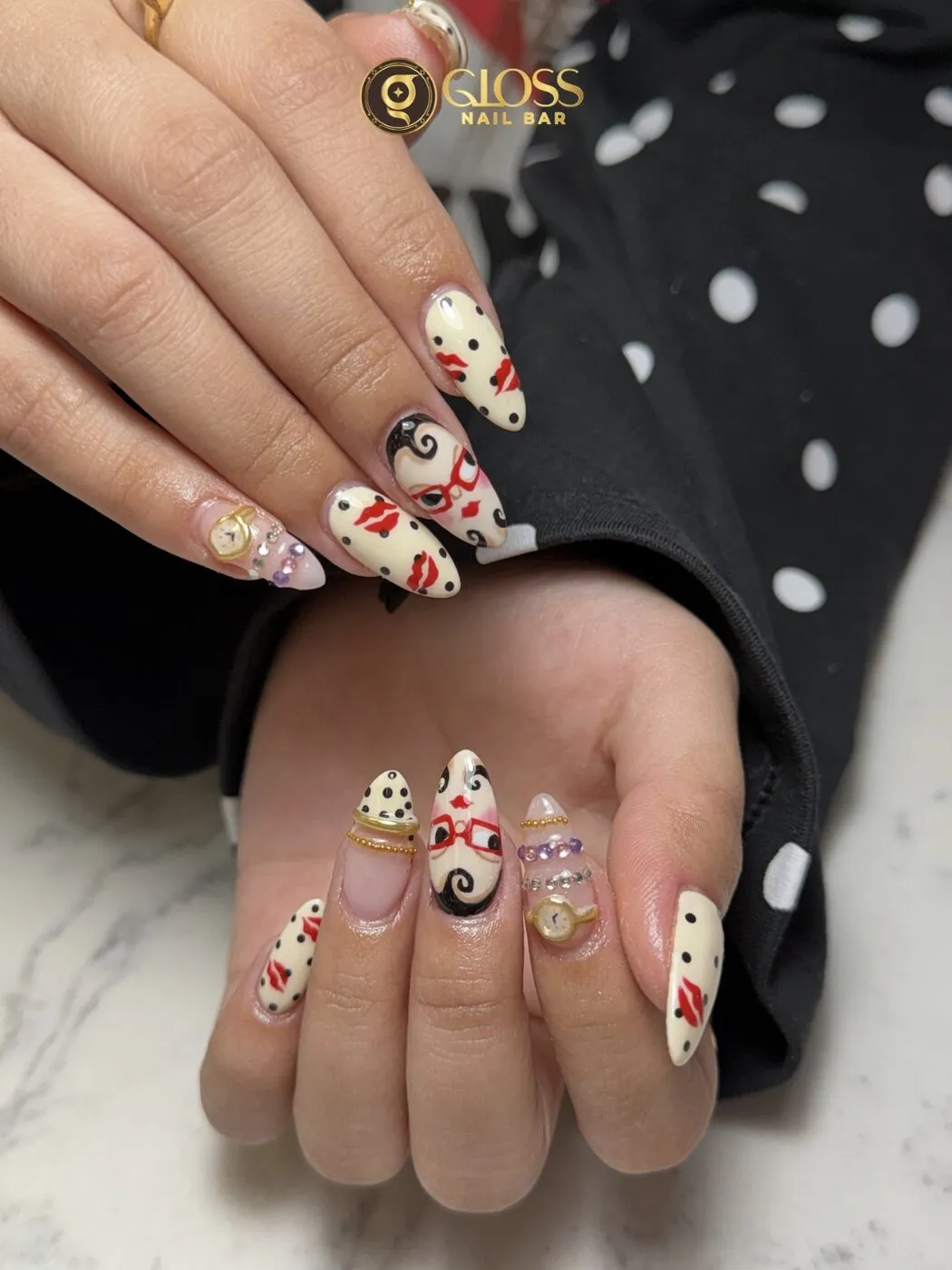 Hand-painted pop-art almond set with polka dots, kiss marks and gold charm details