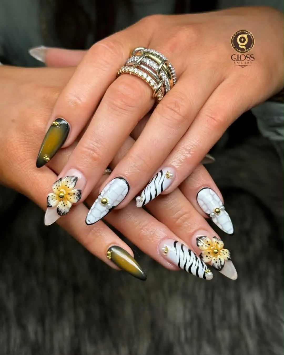 White croc and zebra print nails with 3D lily flowers and olive cat-eye accents